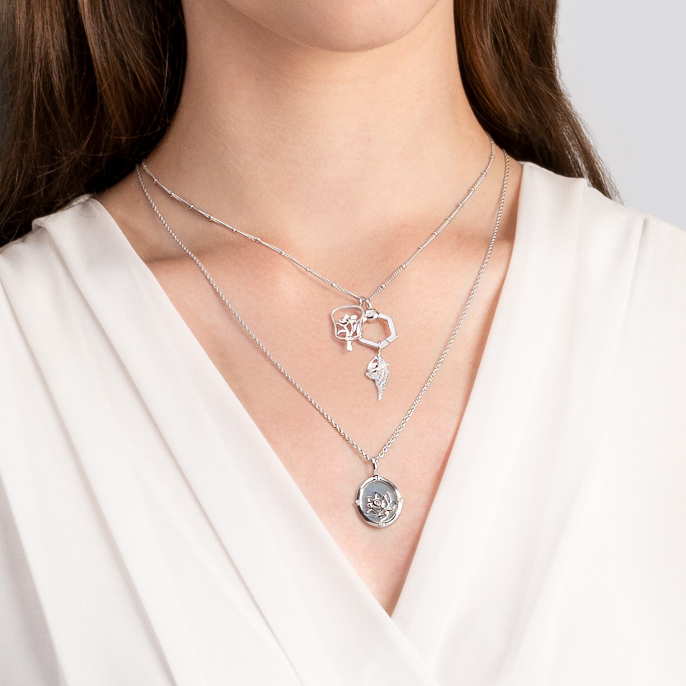 Noble Lotus Charm Silver And Orchid Hand Fan Charm Silver And Joyous Dancer Charm Silver Model Image 2  | Shen Yun Collections